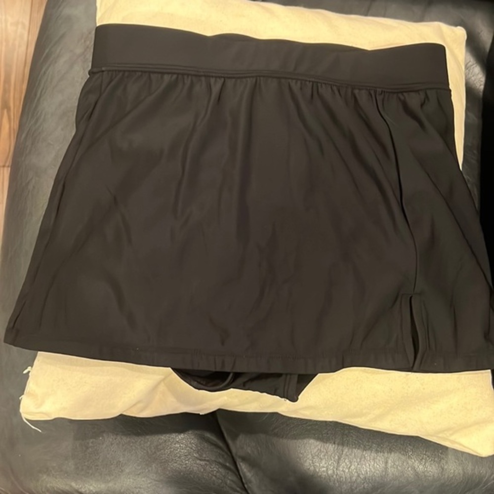 Black bikini coverup/skort. Women’s size small.